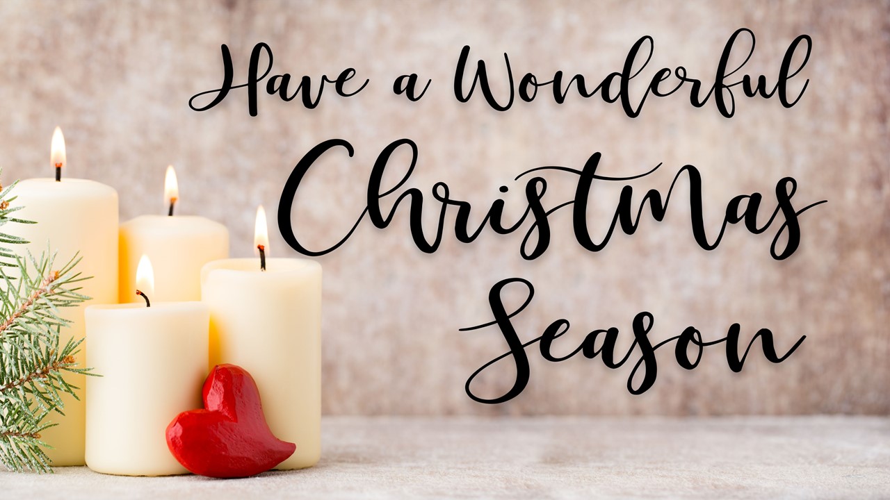 Stock photo of Christmas candles with the words "Have A Wonderful Christmas Season" displayed