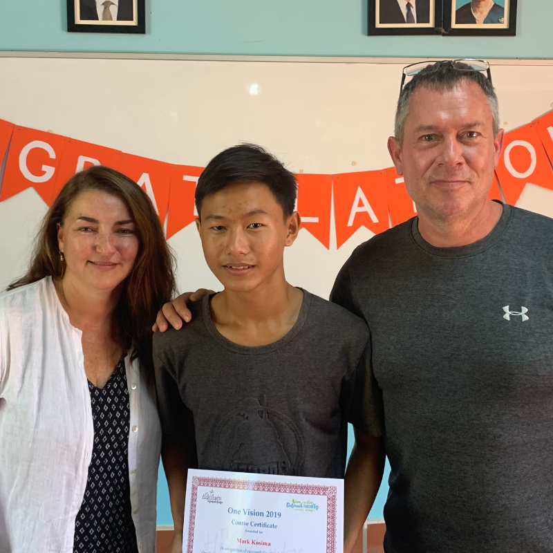 Noel standing with graduate