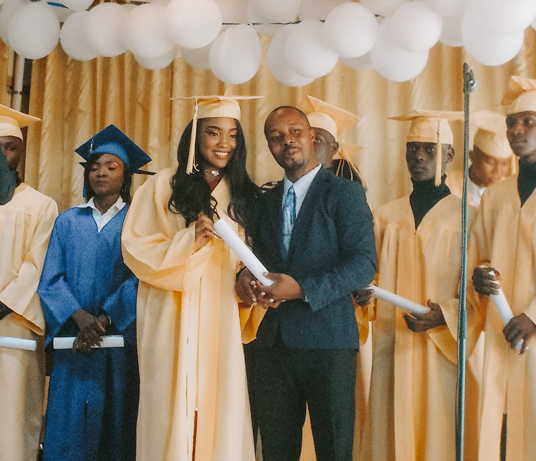 Photo of a girl receiving her diploma at a graduation Photo of a girl receiving her diploma at a graduation