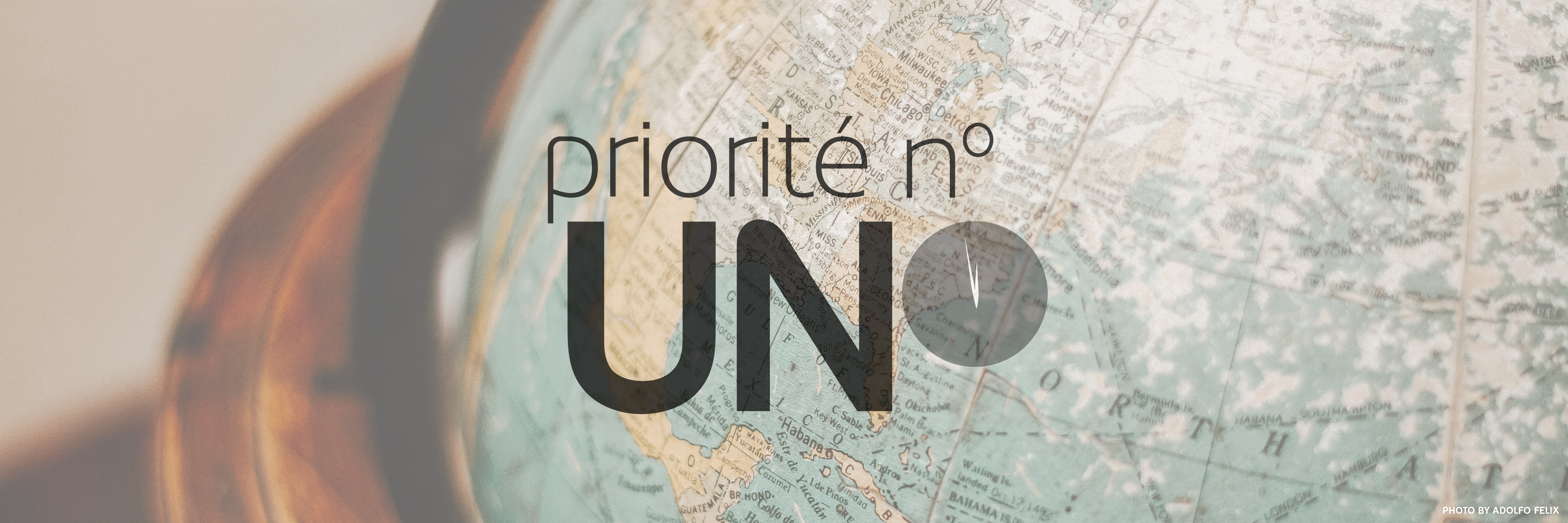 Priority ONE French logo with a world map behind it