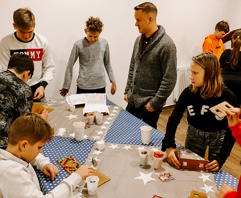 Photo of a group of students working around a table.