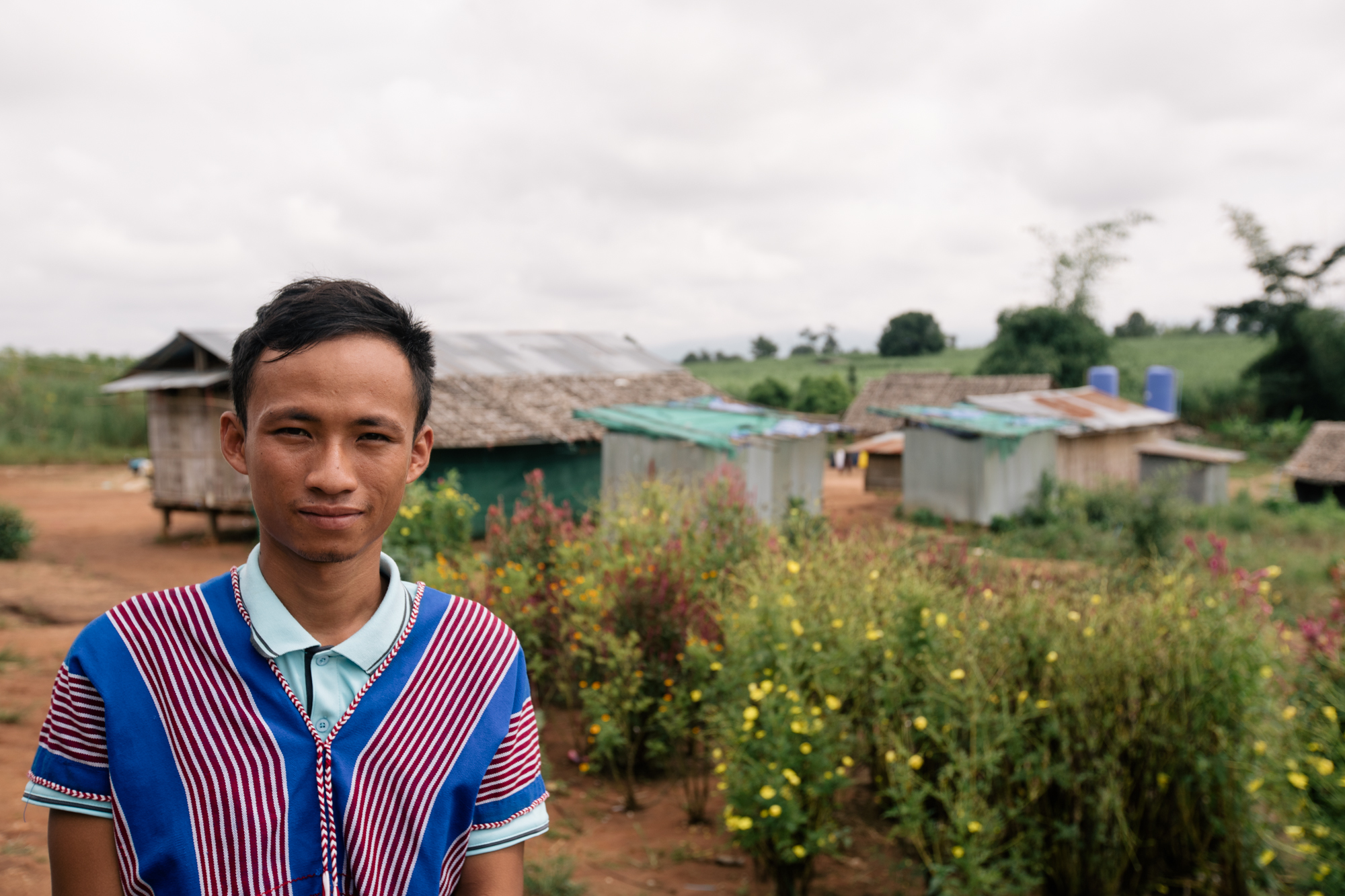 Photo of a guy smiling at the camera by Imagine Thailand