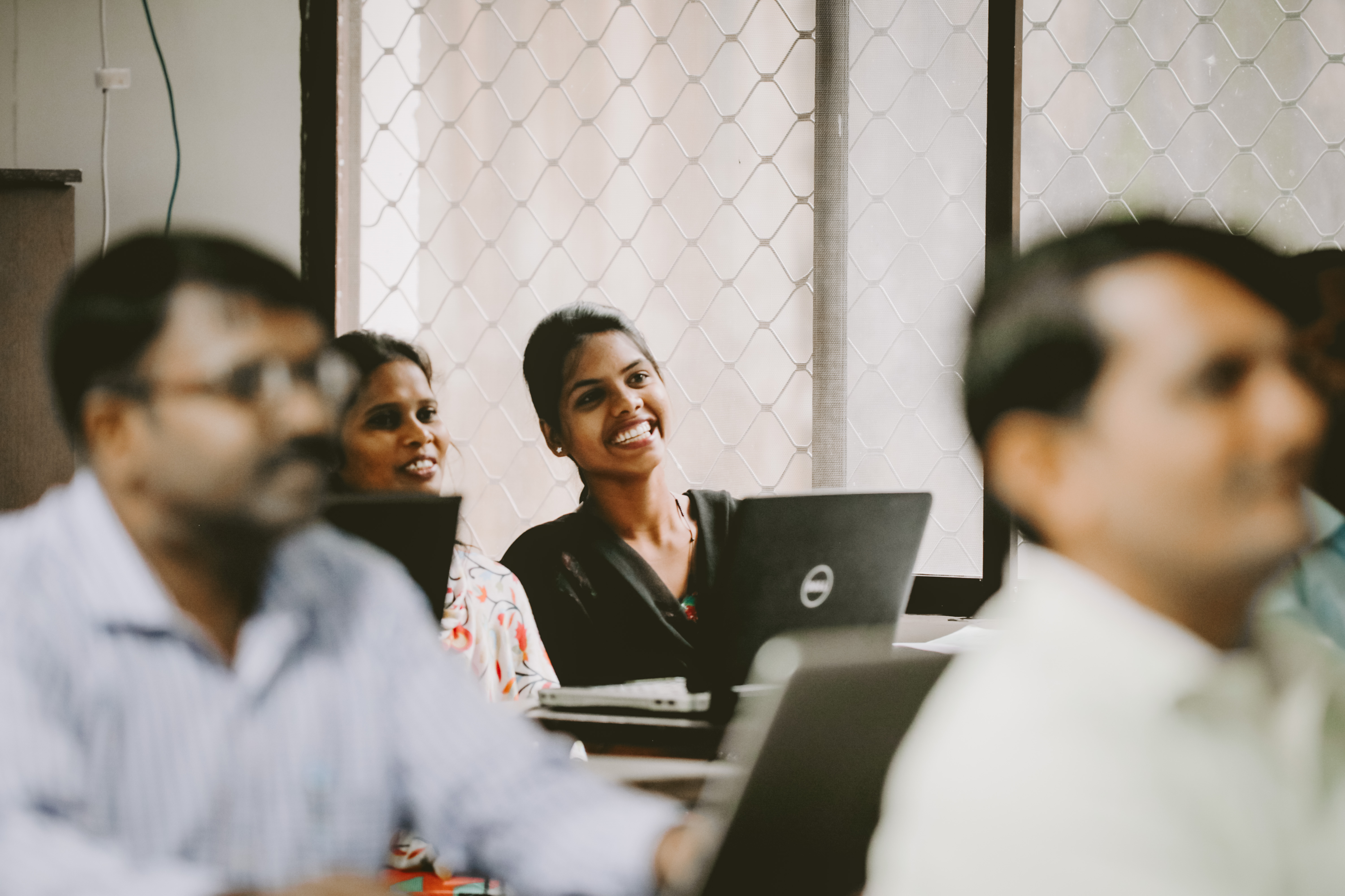 Photo of two women at a skills training seminar in India.