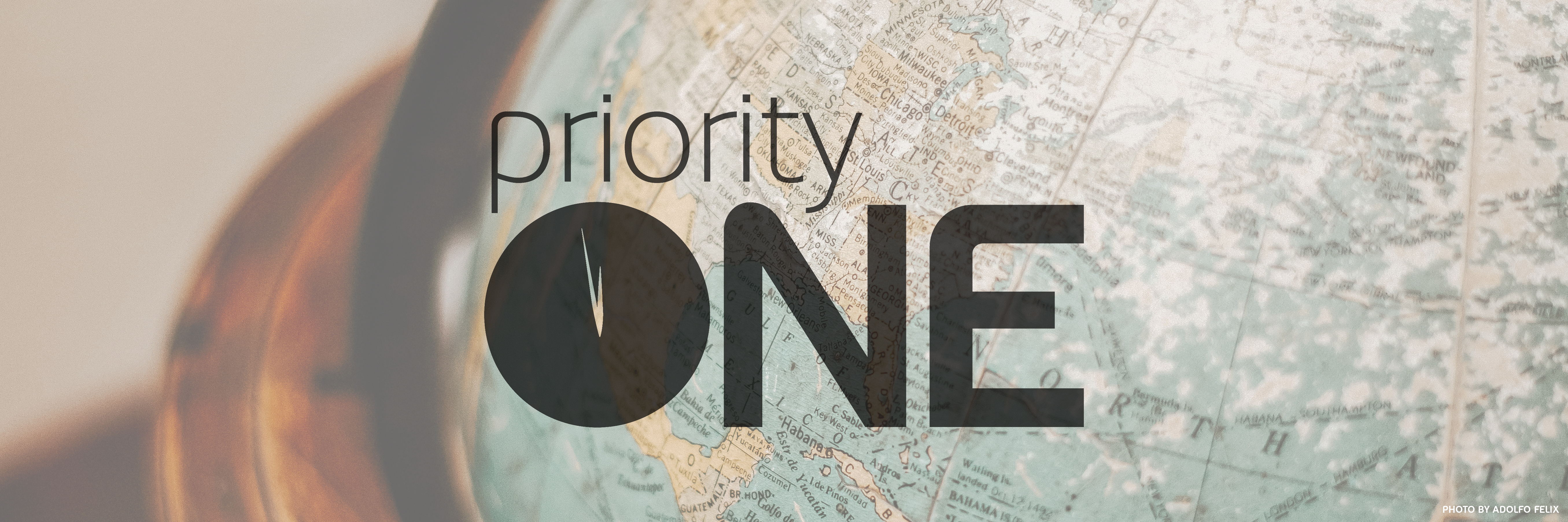Priority ONE logo with a world map behind it