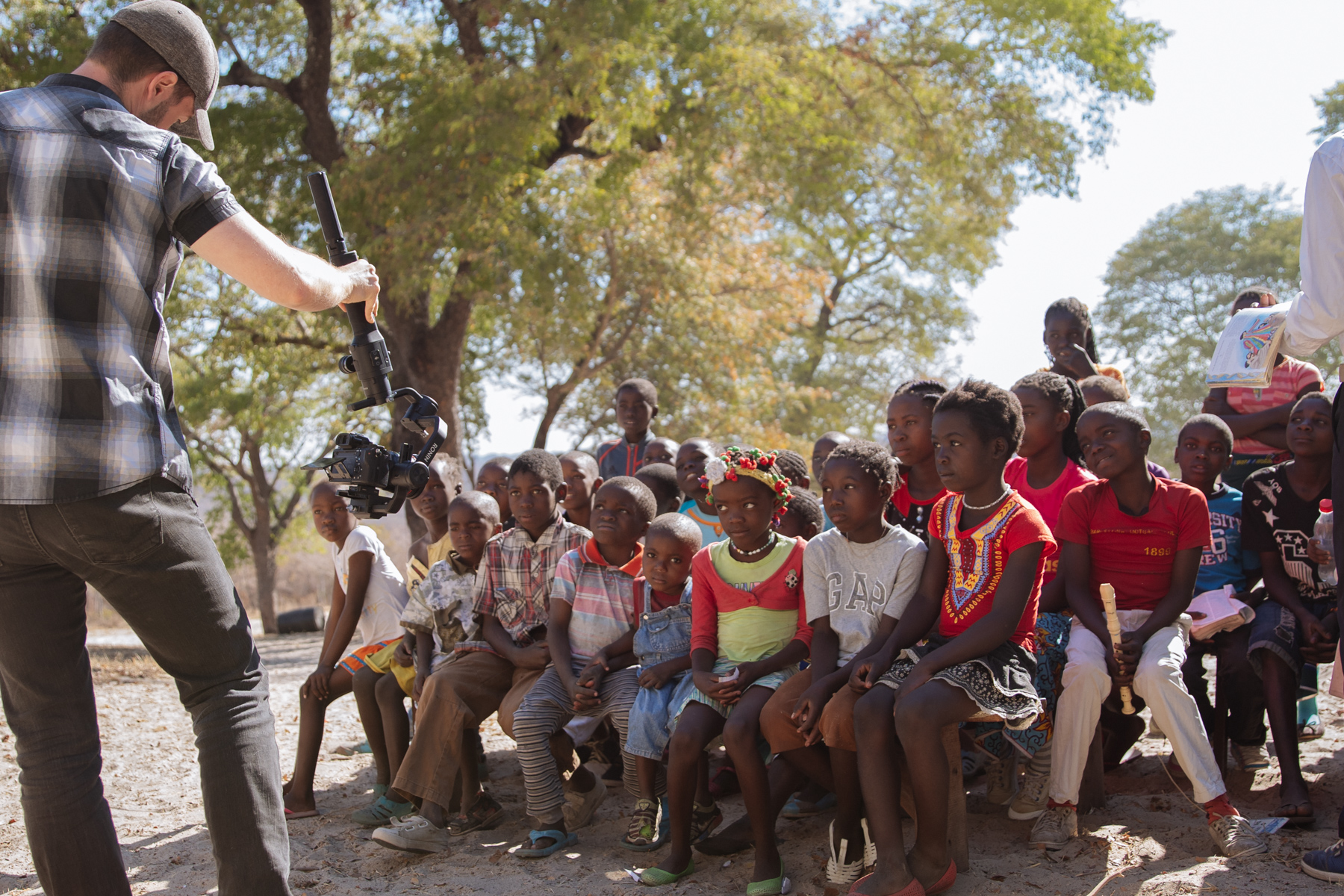 Jordan in Angola taking a photo of kids
