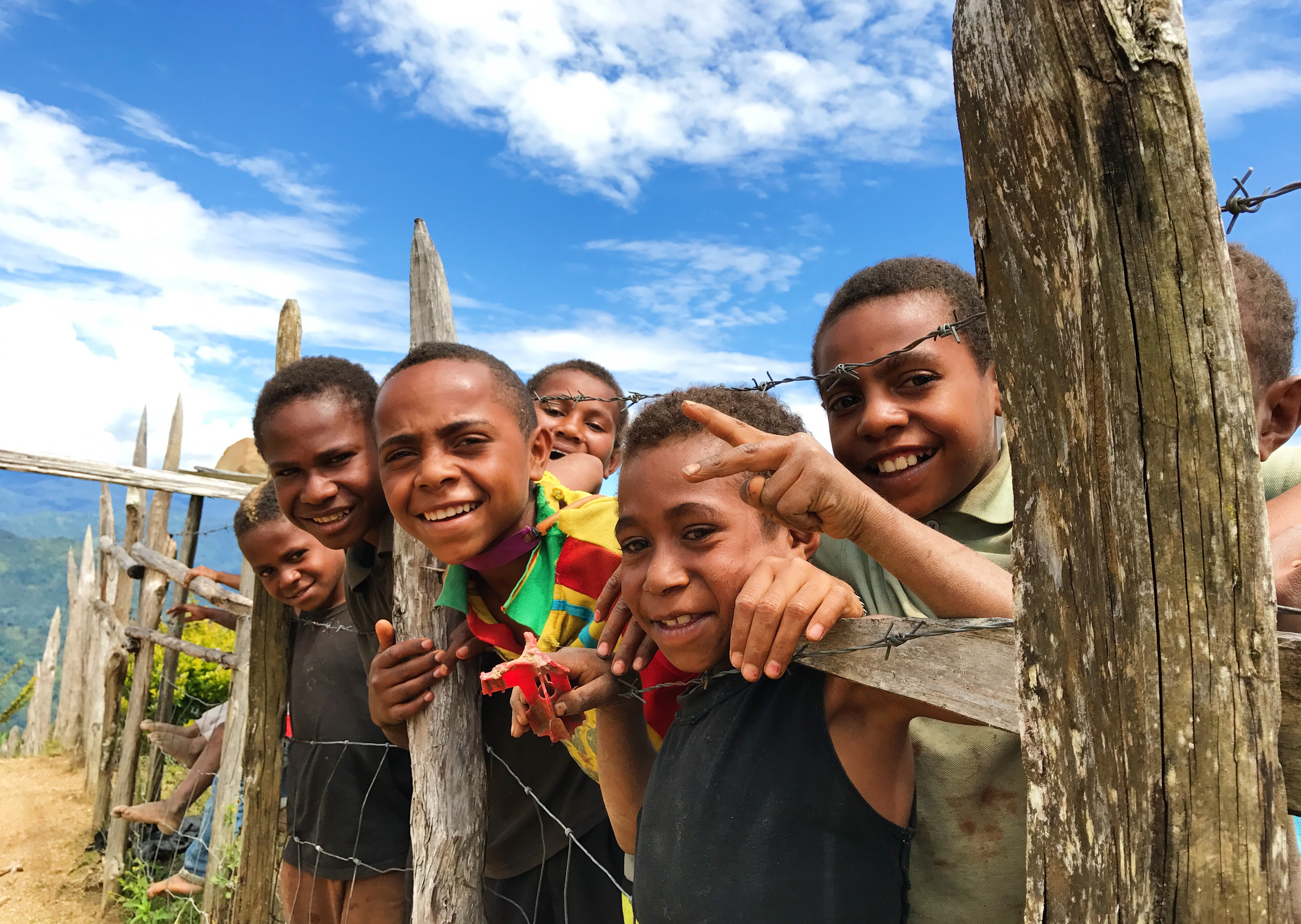 Photo of a group of students in Guinea by Vika Chartier on Unsplash.