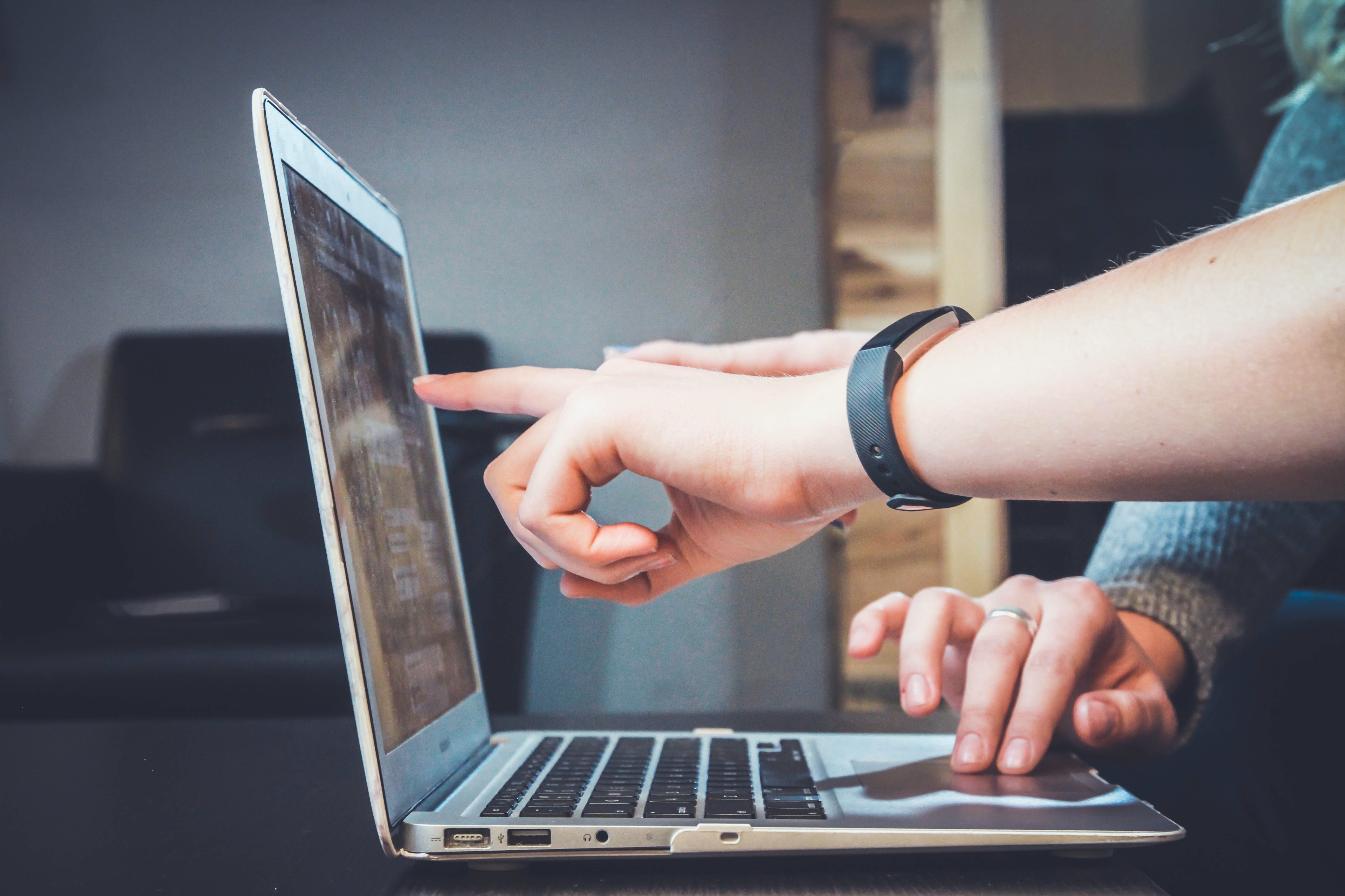 Photo of two people working on a laptop by John Schnobrich on Unsplash.