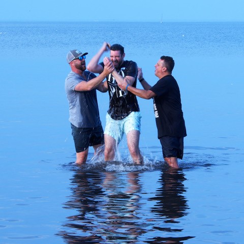 A person being baptized.