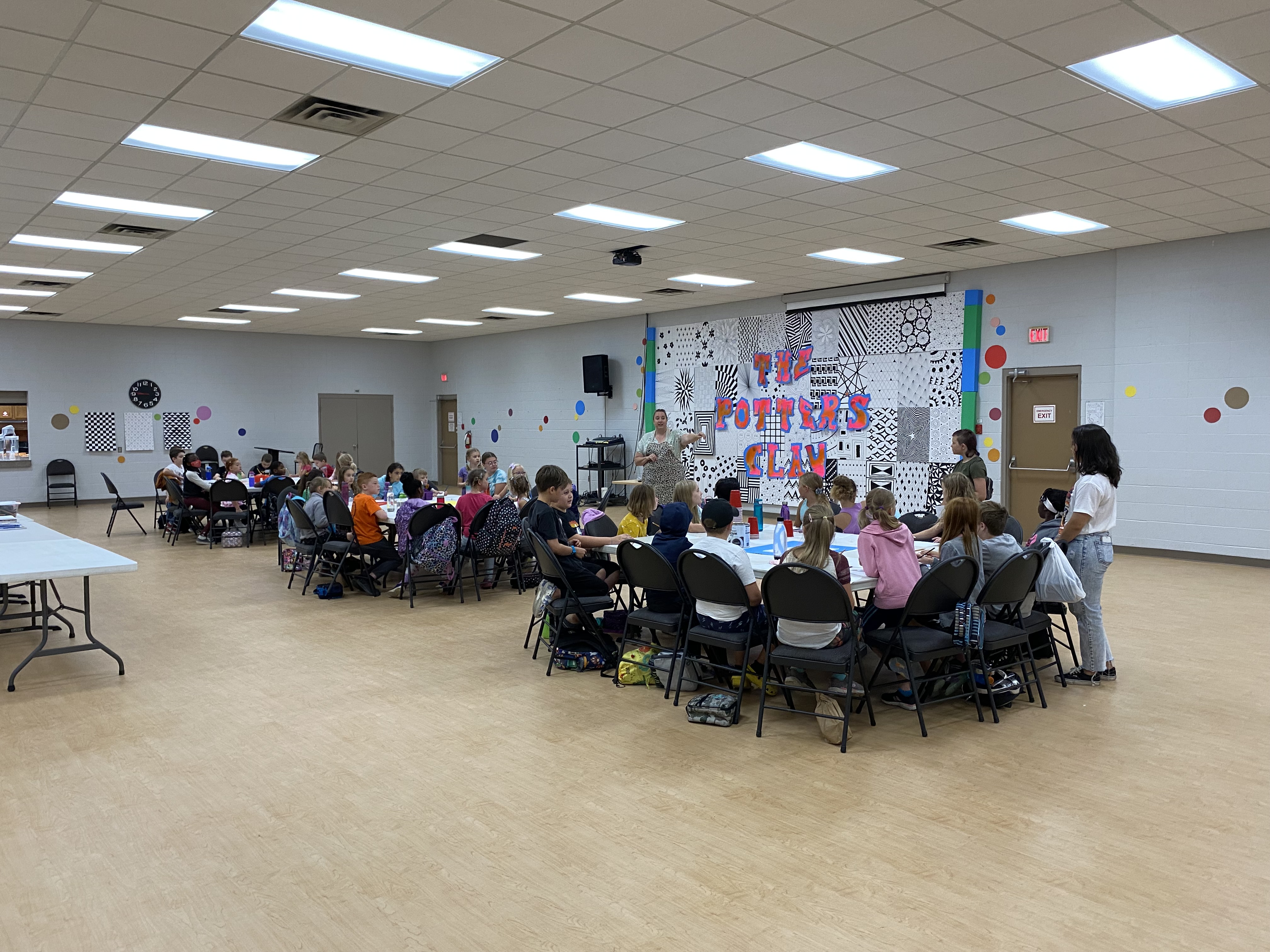 Shay Anderson 2 Children sitting at tables at the Art Day Camp held at The Park Church.