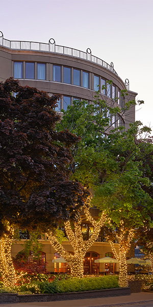 A hotel building behind trees