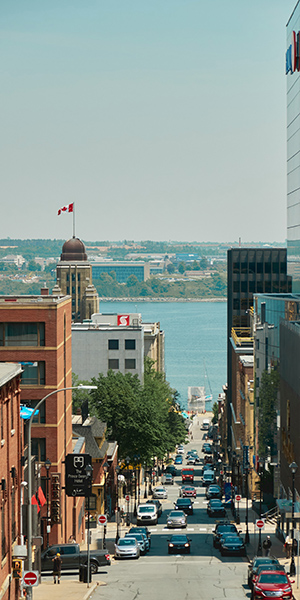 Downtown Halifax looking down a road leading towards the halifax harbour in the distance
