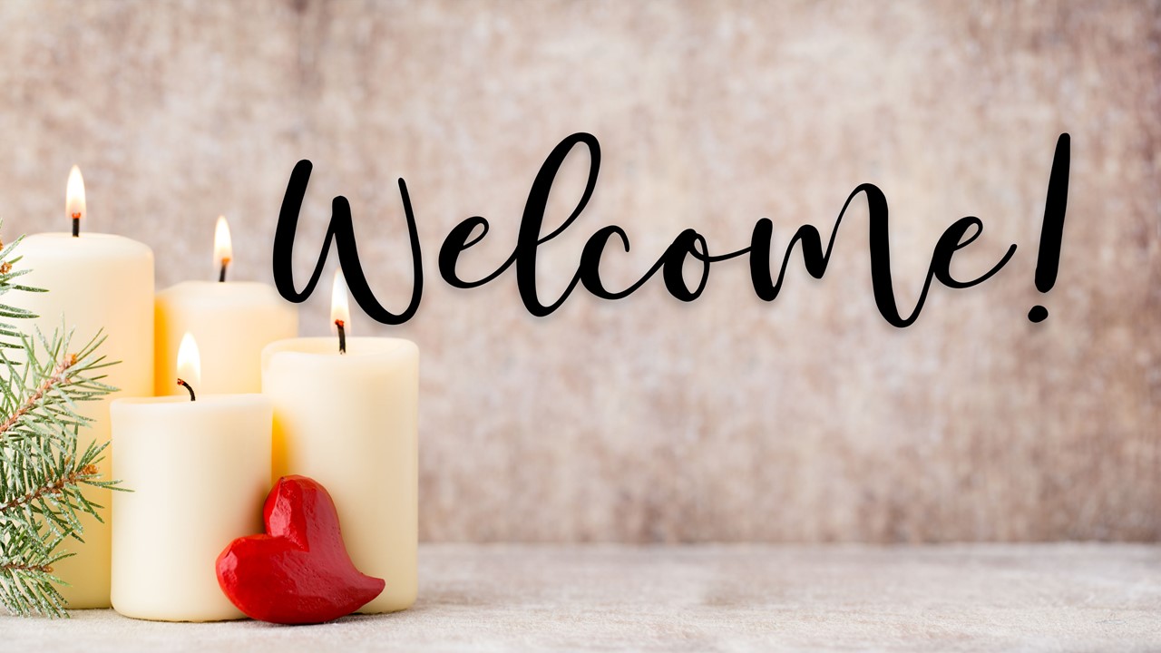 Stock photo of Christmas candles with the text "Welcome" displayed