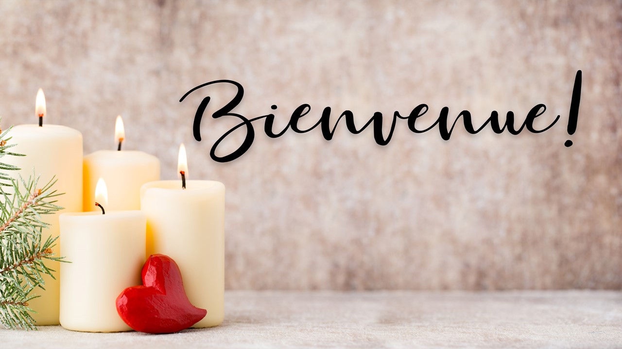 Stock photo of Christmas candles with the text "Welcome" displayed